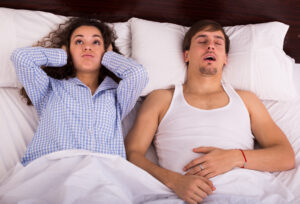 snoring man sleep apnea treatment concept
